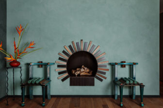 Decorative fireplace with artistic detailing, vibrant accents, and contemporary lounge decor