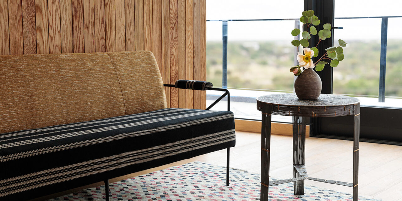 close up of couch in suite and balcony with view
