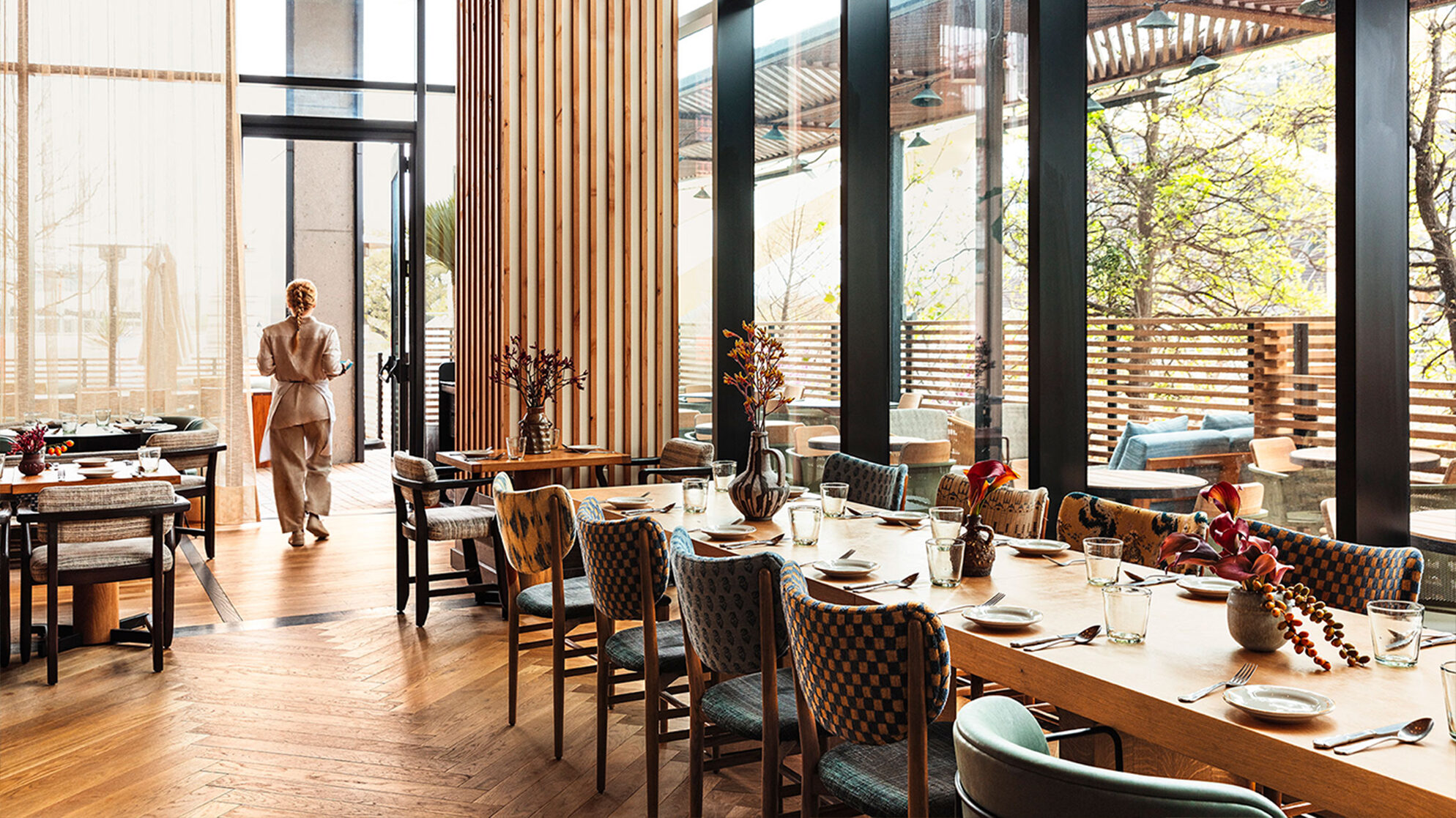 Peacock indoor dining room with server walking by