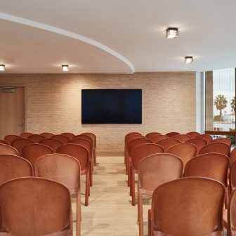 Converge meeting room with movie theater seating set up