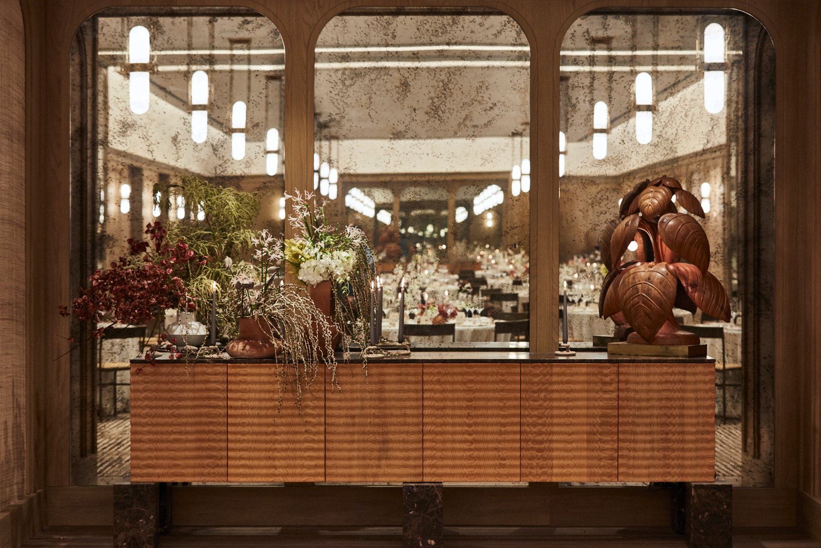 Decorative floral arrangement with mirror backdrop in Canela Ballroom
