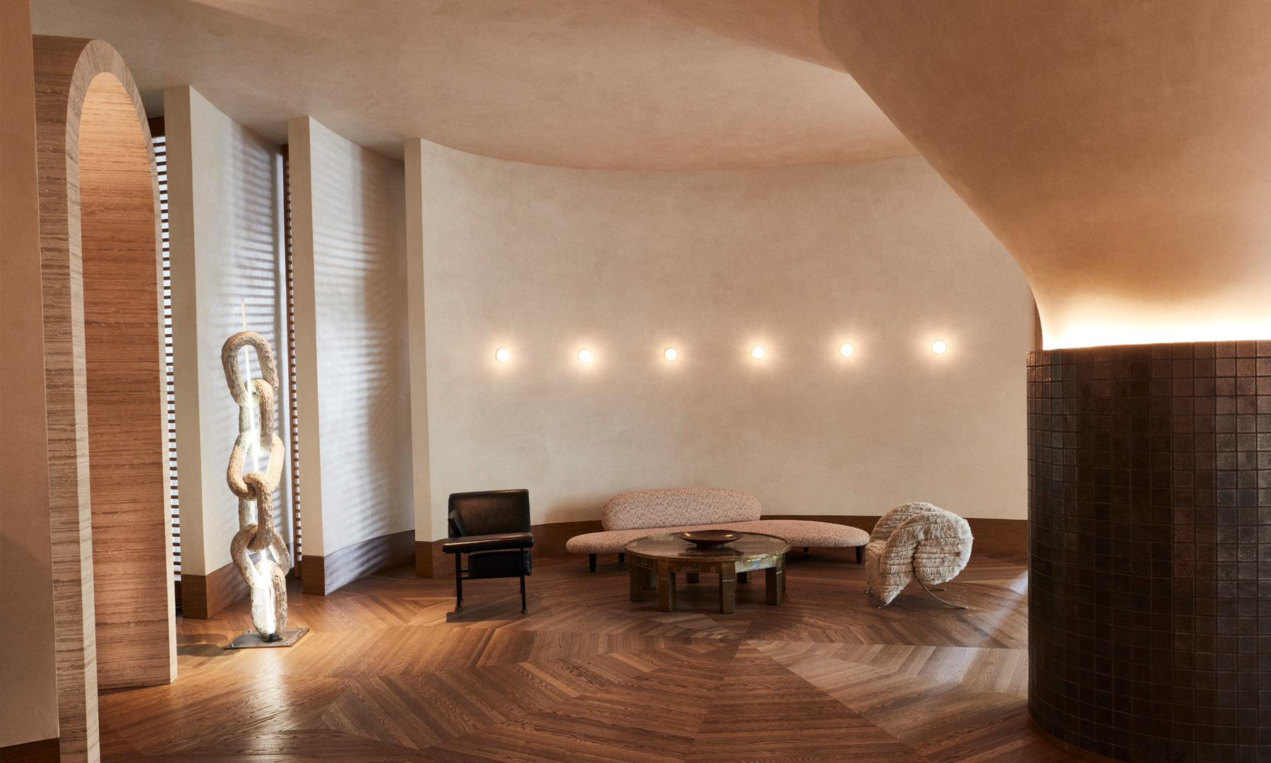 Elegant hotel lounge with curved architecture and contemporary furnishings