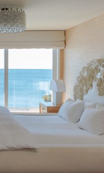 Malibu Beach House master bedroom with ocean front balcony and kelly wearstler custom decor