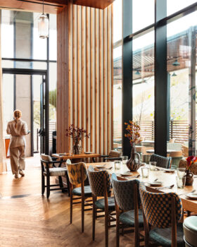 Peacock indoor dining room with server walking by