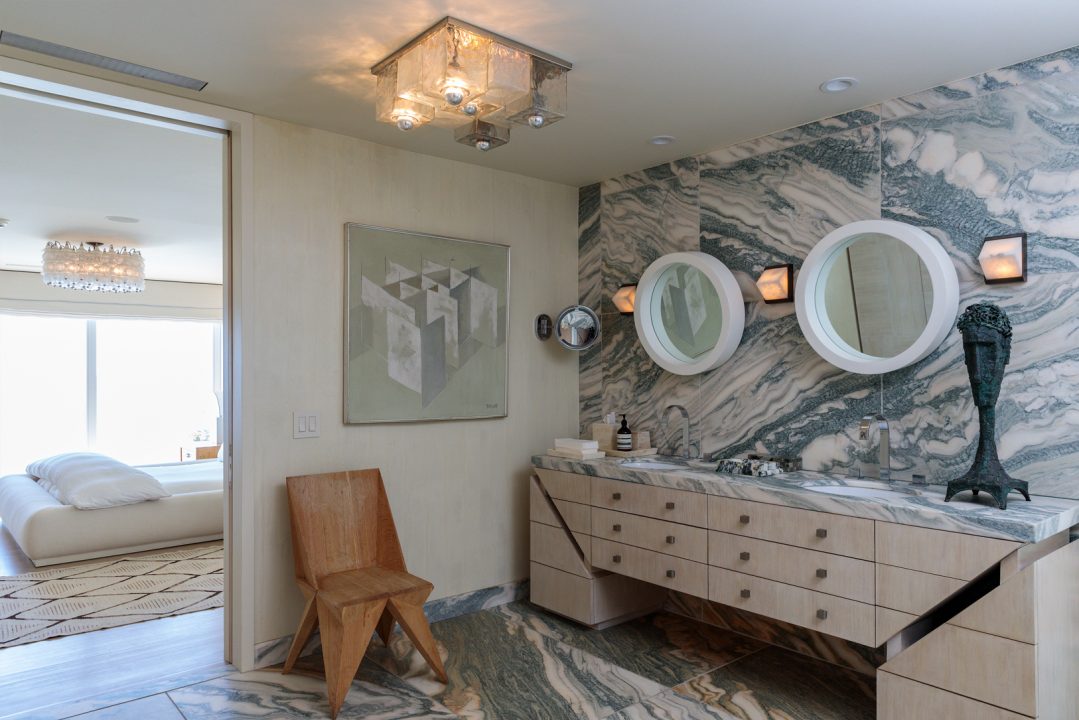 Malibu Beach House large bathroom with double vanity and marble walls