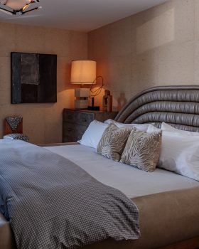 Malibu beach house bedroom with king sized bed and kelly wearstler custom designs