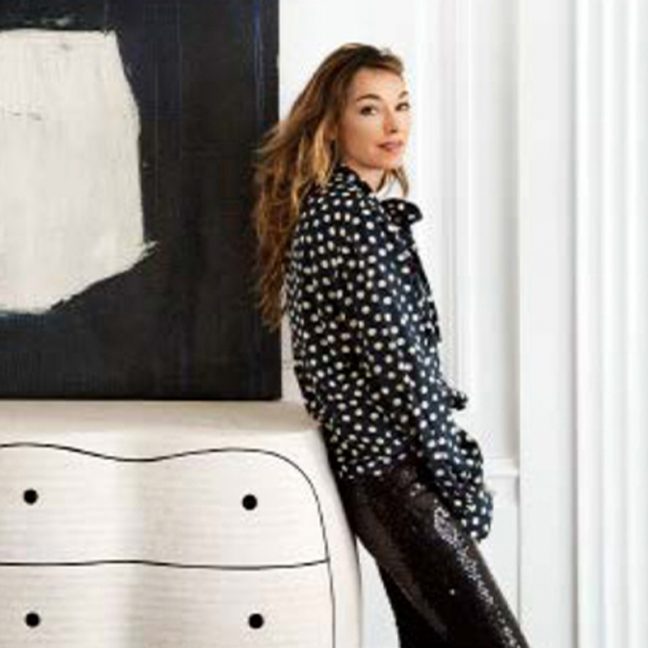 Kelly Wearstler leaning against a drawer