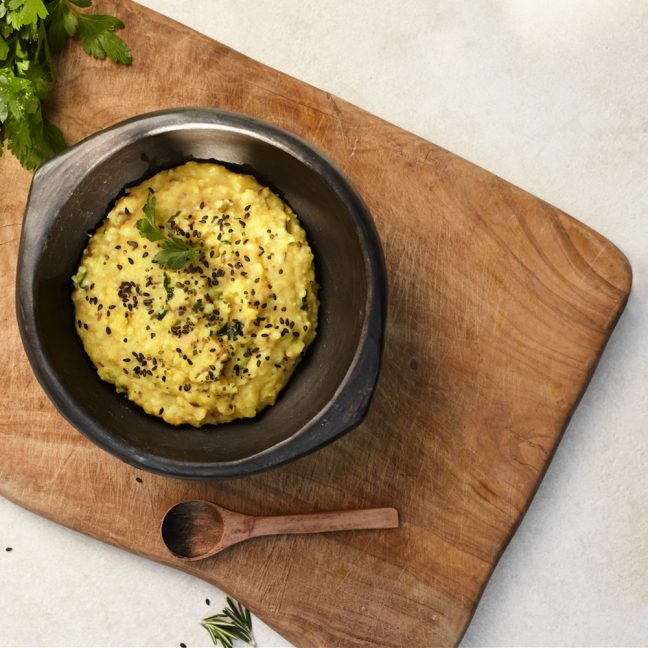 Bowl with entree on wooden board
