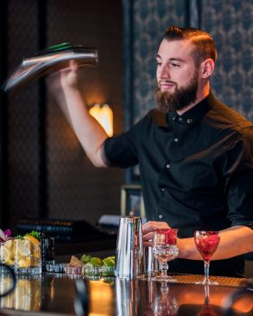 Charmaines bartender mixing cocktails