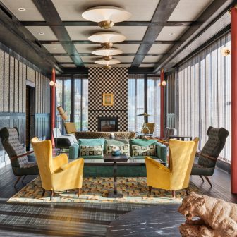 Elegant rooftop lounge with designer seating and fireplace centerpiece