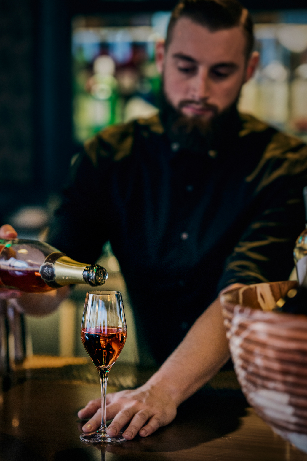 charmaines bartender pouring a glass of rosé