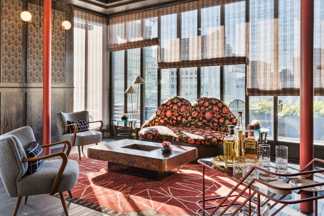 Stylish rooftop lounge with city views, designer seating, and natural light