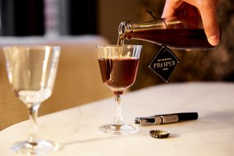Pouring welcome drink in guest room at San Francisco Proper Hotel