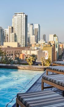 Downtown LA Proper Rooftop pool with view of city skyline