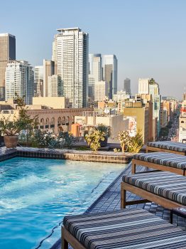 Downtown LA Proper Rooftop pool with view of city skyline