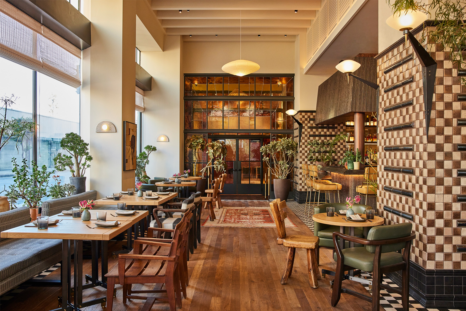 Warm, stylish restaurant with natural light and inviting wood accents.