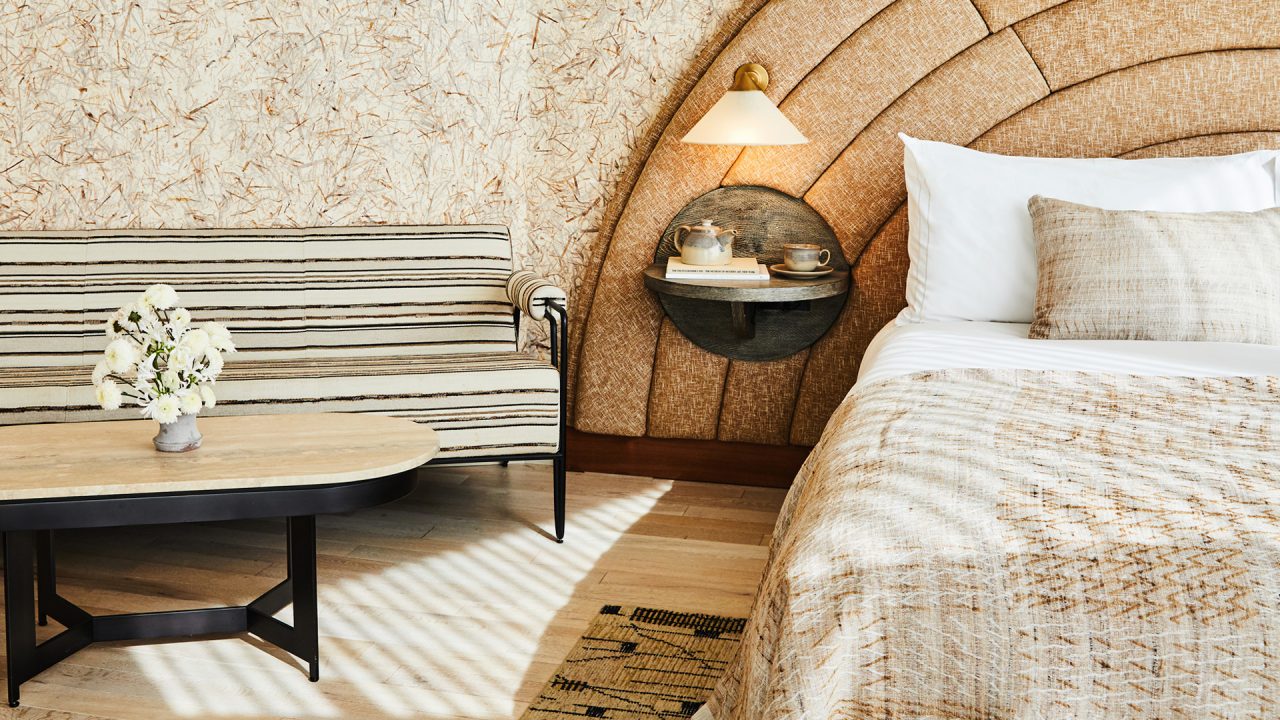 Close Up of Santa Monica Proper Suite King Bed and Side couch and table