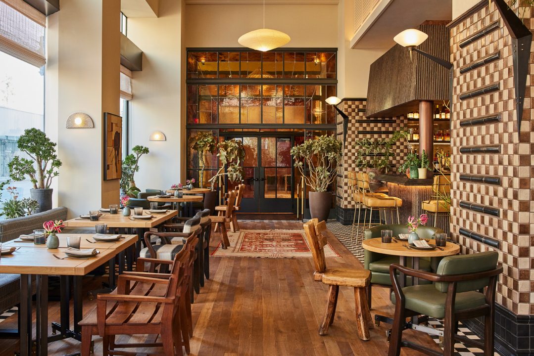 Elegant restaurant interior with artisan tilework, warm wood accents, and contemporary Downtown LA dining ambiance