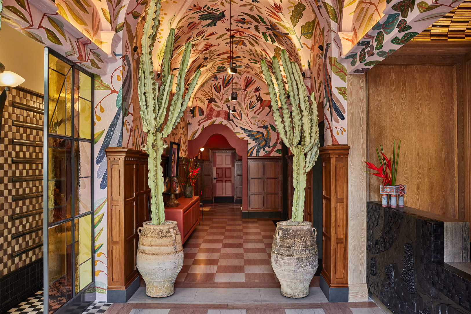 Downtown LA Proper Lobby with art filled decor, mural, and reception desk