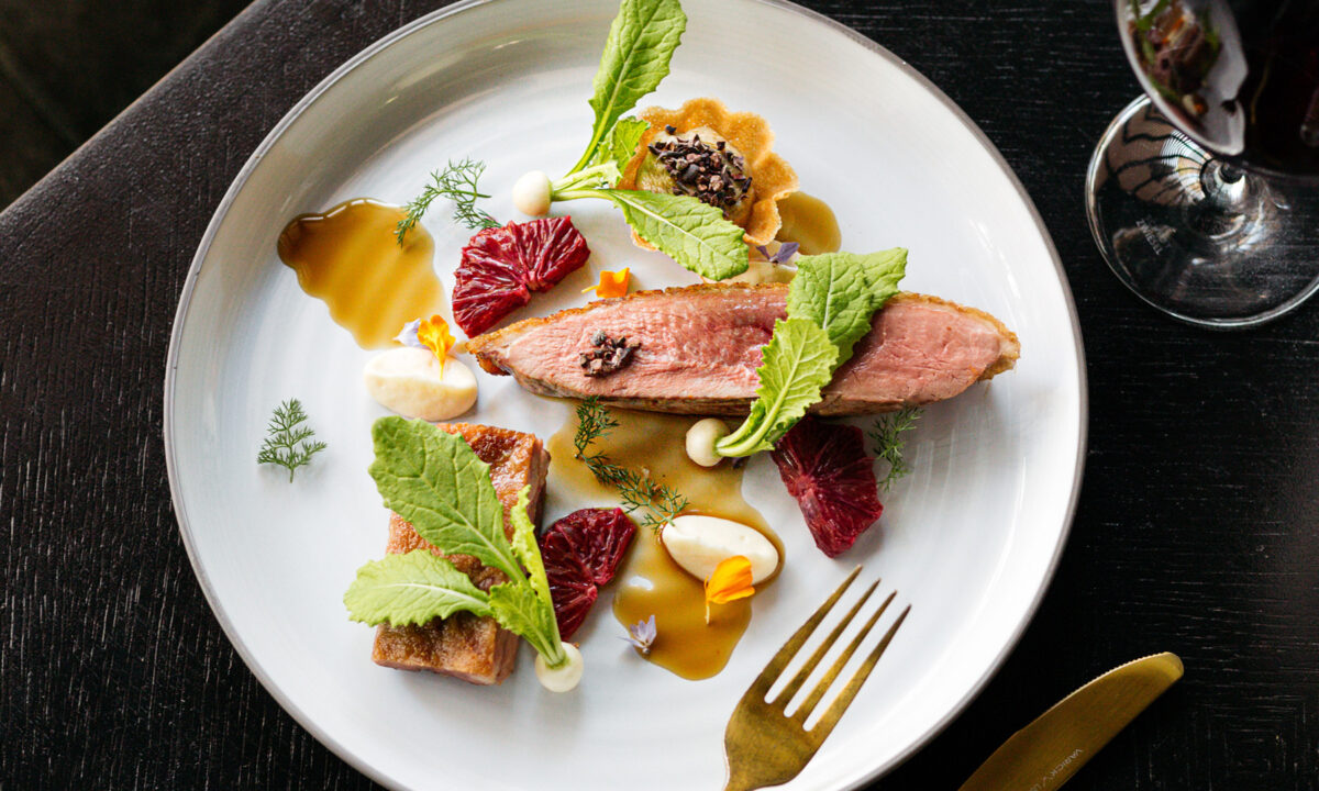 Artfully plated fine dining dish with seasonal ingredients and elegant presentation