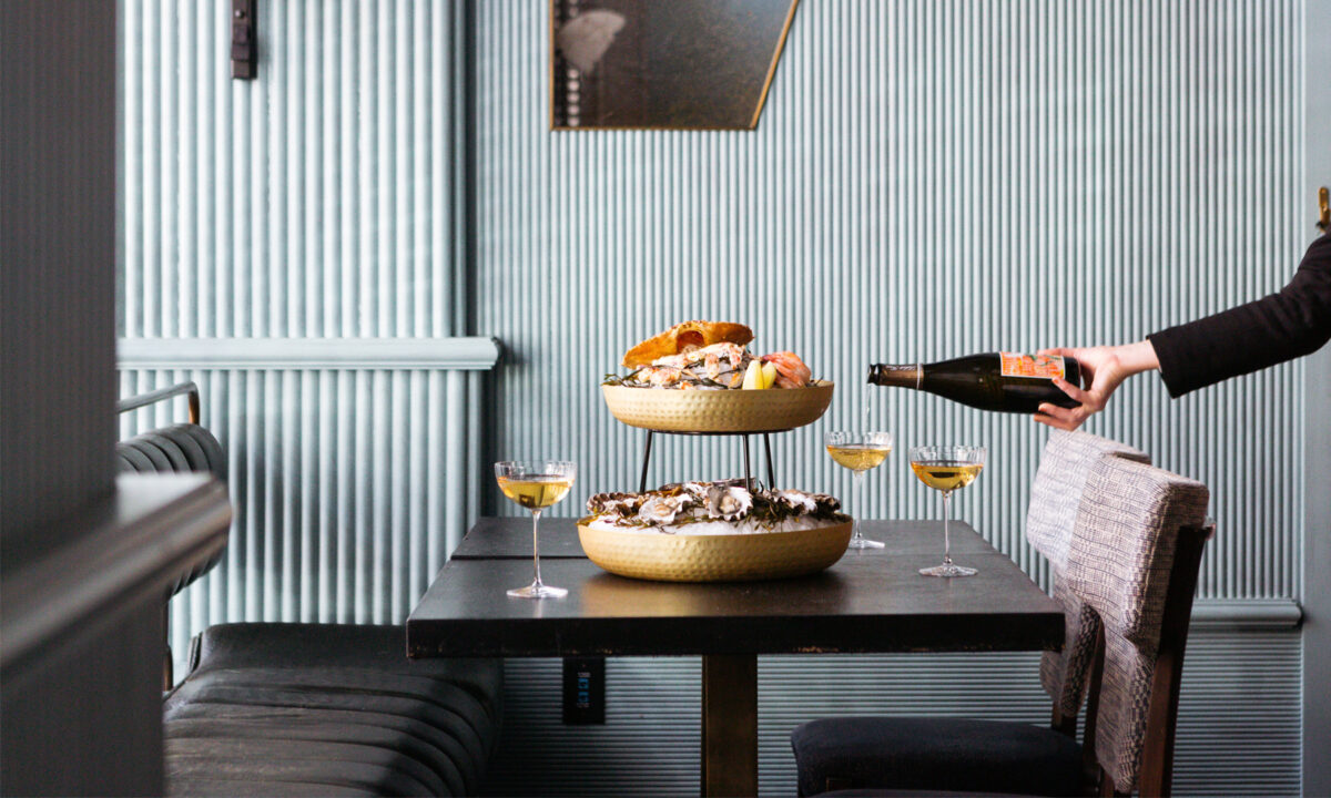 Upscale dining experience with fresh seafood towers and curated wine service