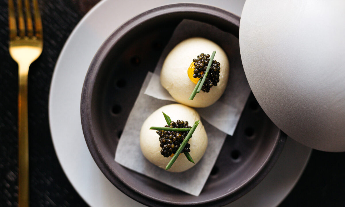 Elegant caviar topped bites served in a modern ceramic dish at Villon San Francisco Proper