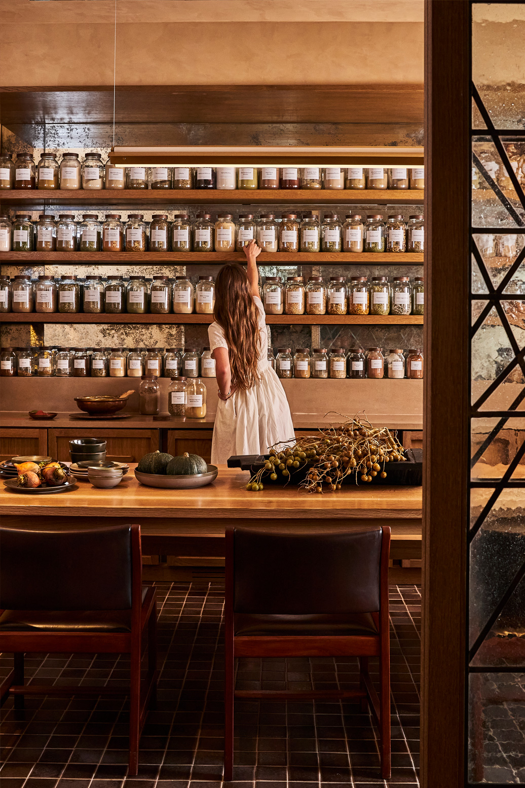 Spa apothecary with curated botanicals and warm wood interiors