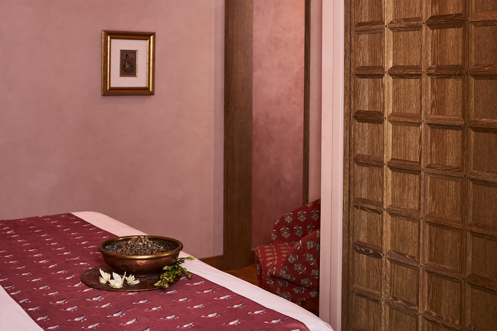 Calming spa treatment room with warm earthy tones and serene details