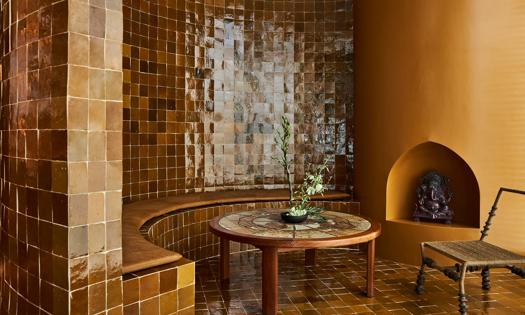 Surya Spa lounge with warm tiled interiors and tranquil seating