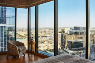 Deluxe Suite bedroom with large windows and view