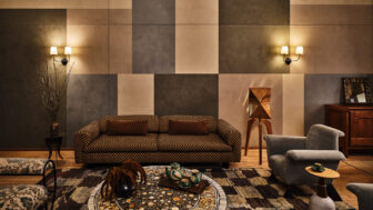 Spacious suite living area with custom furnishings and dramatic geometric interiors