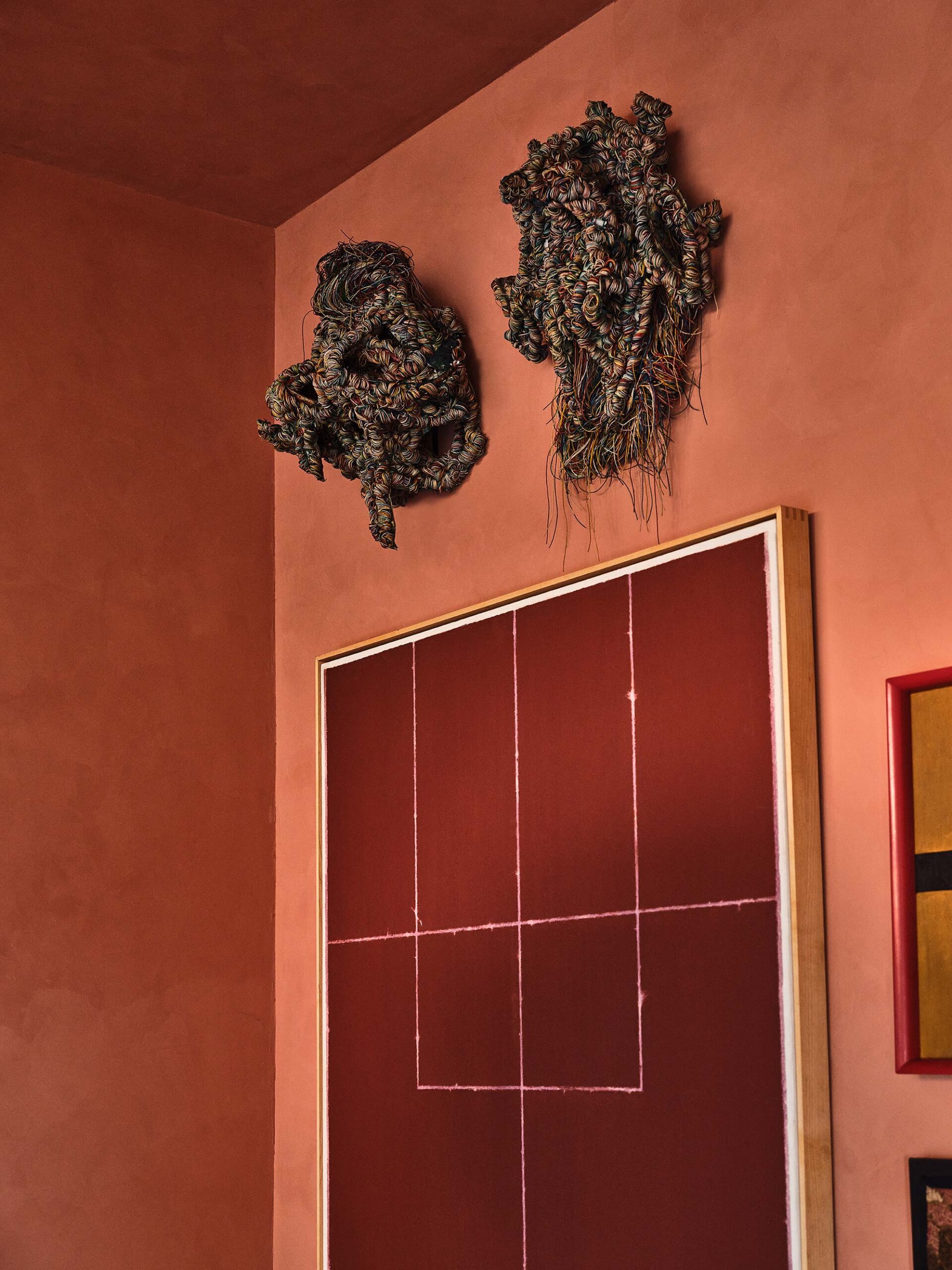 Contemporary abstract artwork displayed on warm toned luxury hotel interior wall