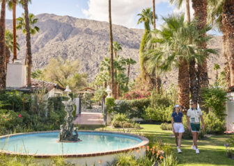 Lush desert garden with mountain views and classic charm.