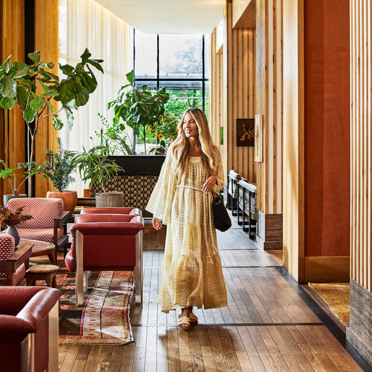 Guest walking through lobby of Austin Proper
