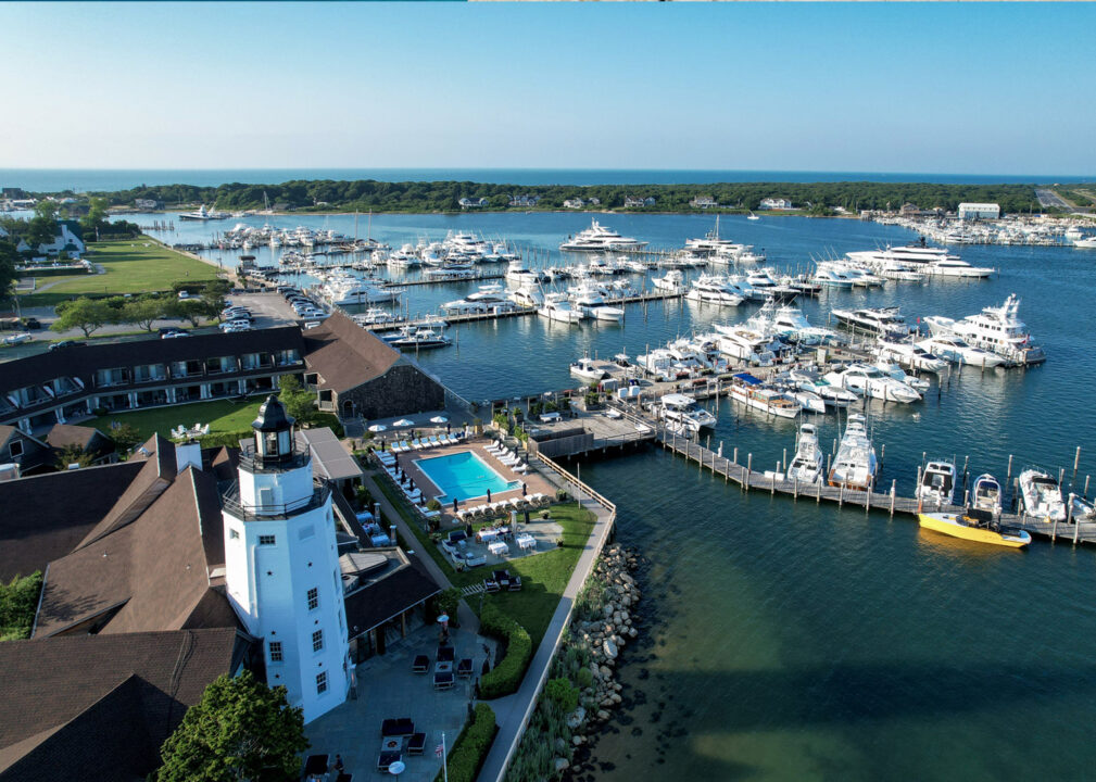 Waterfront marina with lighthouse and scenic harbor views.