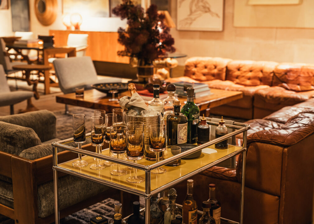 Elegant cocktail lounge setup with curated spirits and cozy seating area
