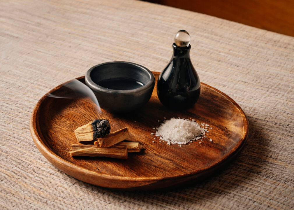 Wooden tray with incense, salt, and spa essentials