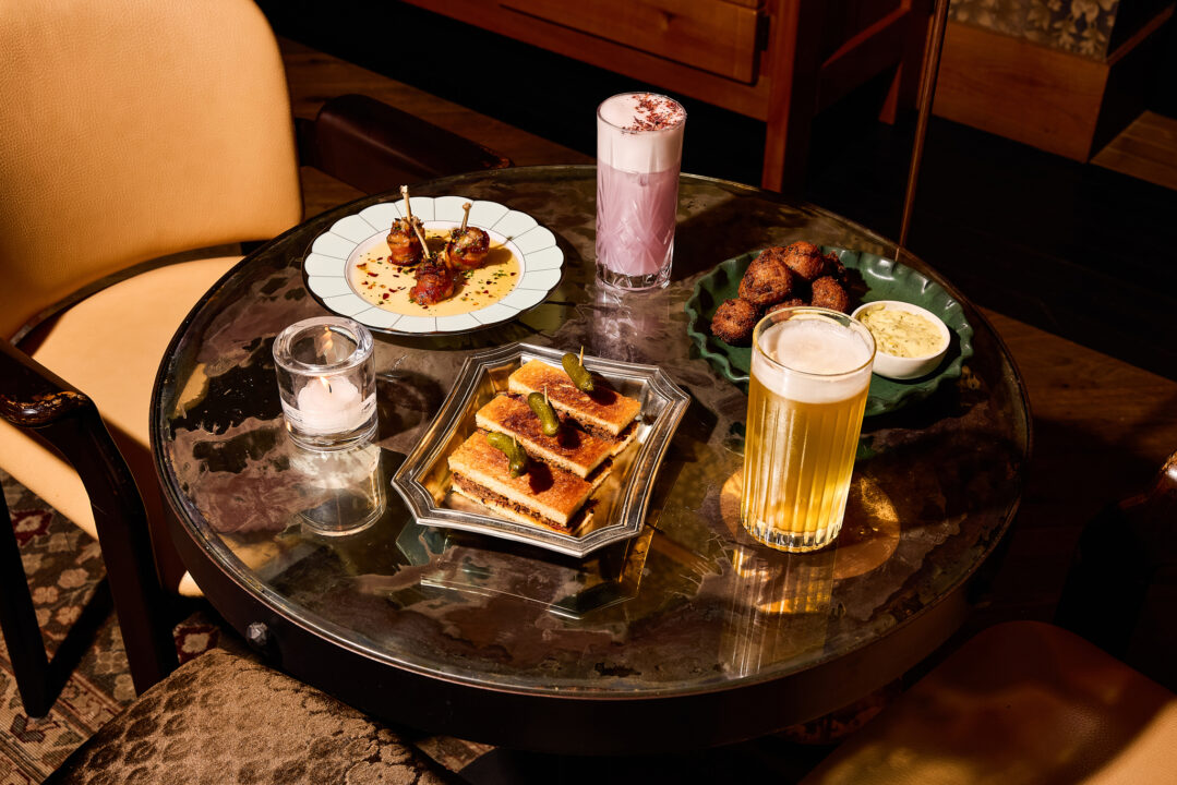 Cocktails and small plates on a marble table