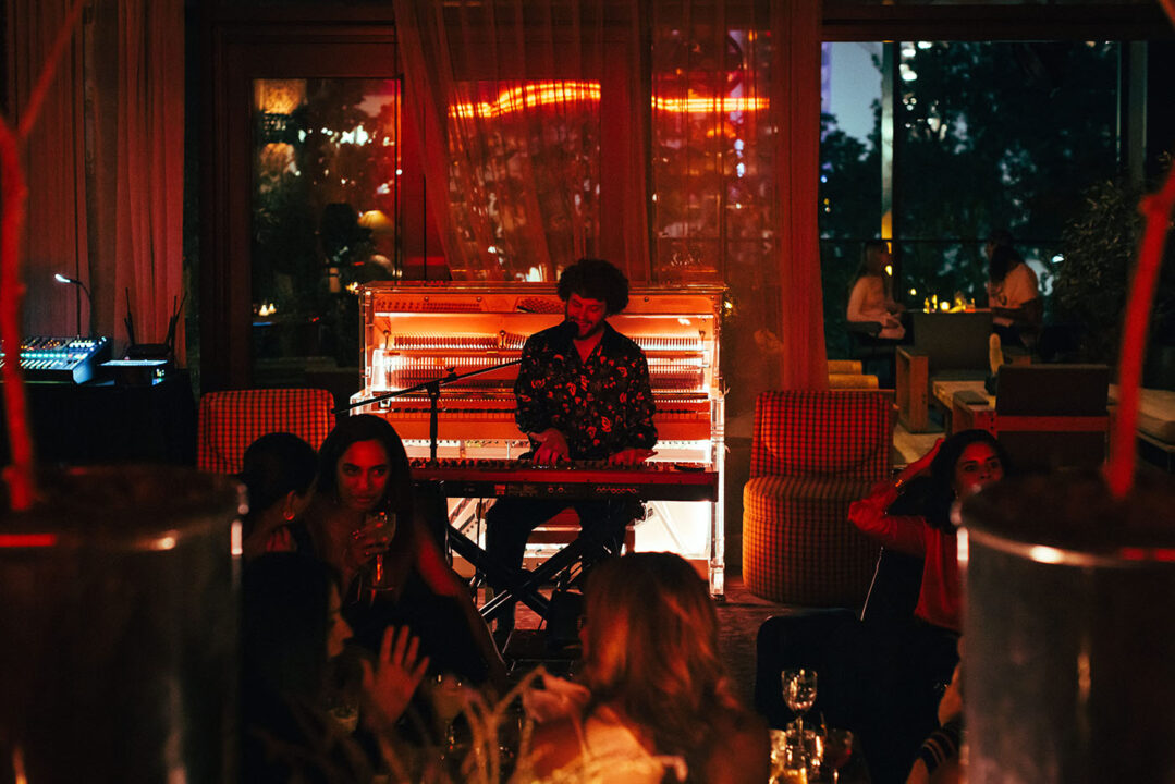 Live pianist performing in a dimly lit lounge