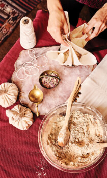 Spa preparation with herbal powders, bowls, and handmade wellness pouches