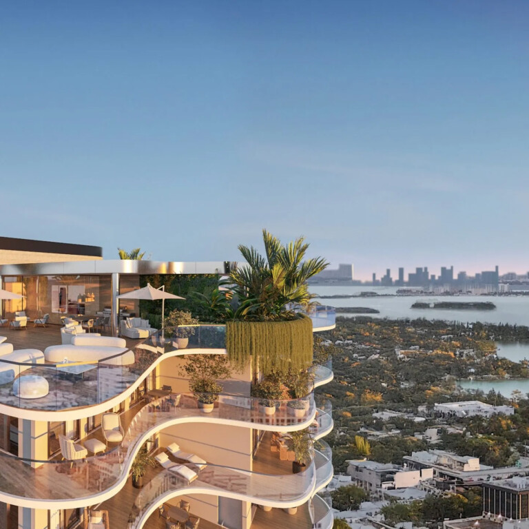 Curved luxury terrace with panoramic waterfront views.