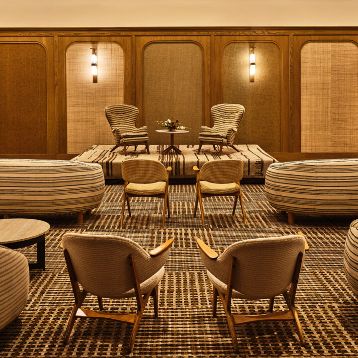 Modern lounge-style event setup with designer seating in luxury ballroom space