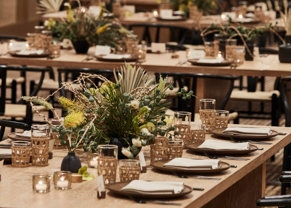 Elegant banquet table setup with floral centerpieces and candlelight for luxury private dining or event space