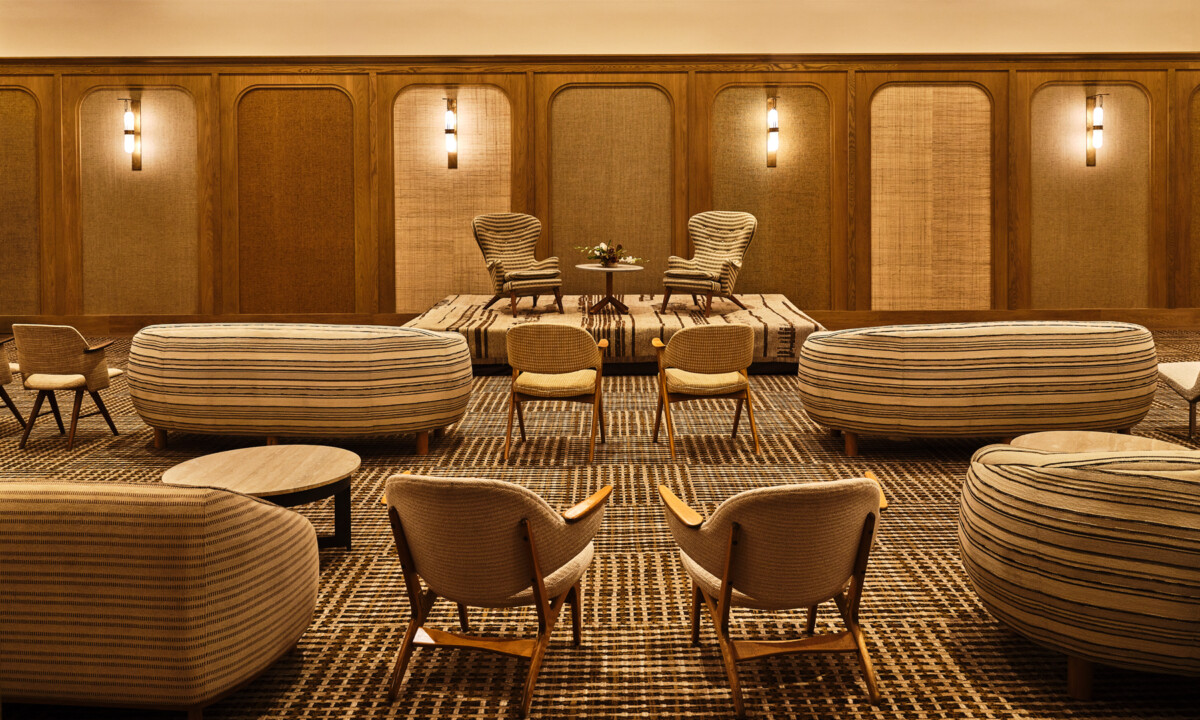 Modern lounge-style event setup with designer seating in luxury ballroom space