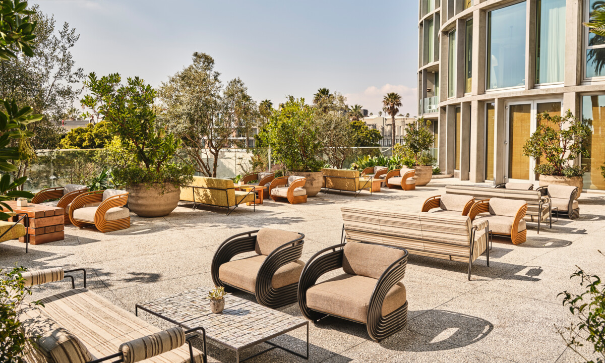 Outdoor terrace lounge with modern seating, greenery, and relaxed gathering spaces
