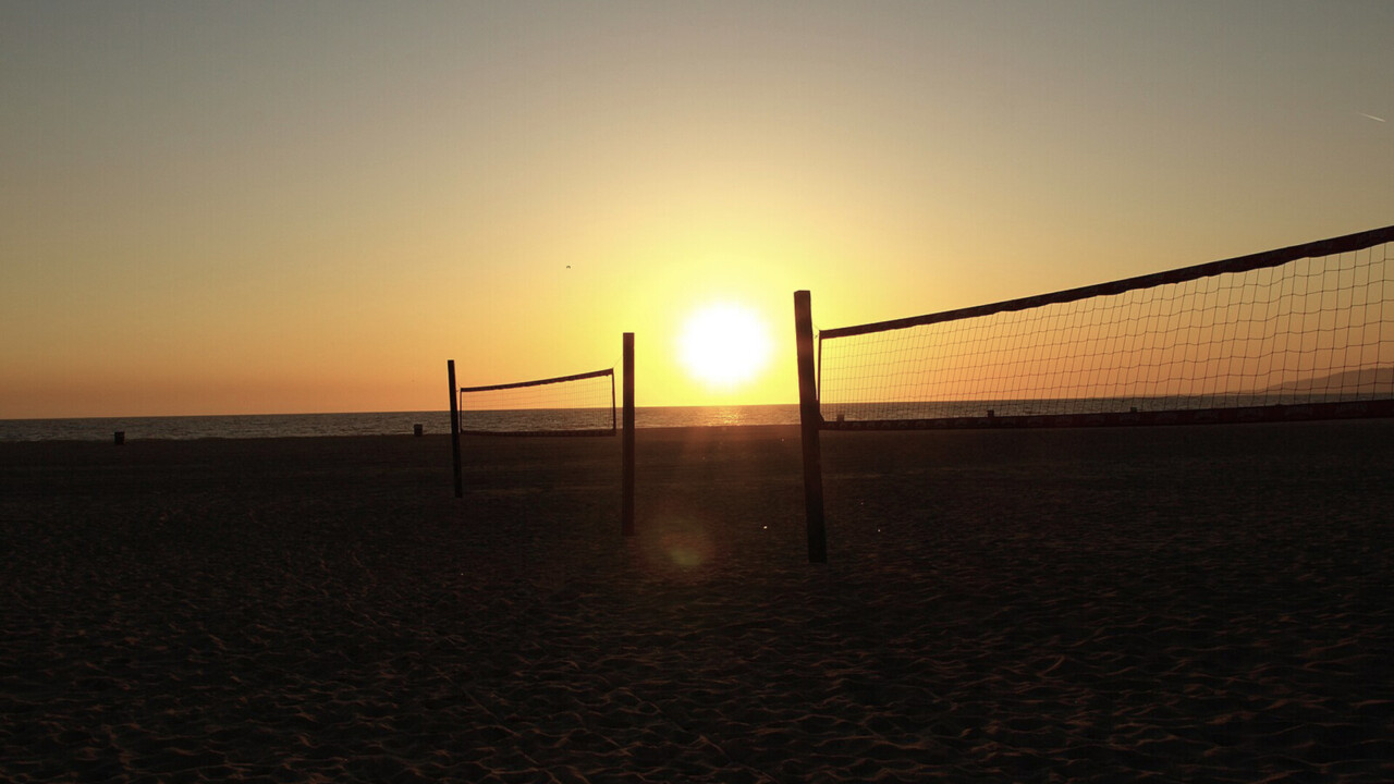 Beach volleyball courts at sunset by the ocean