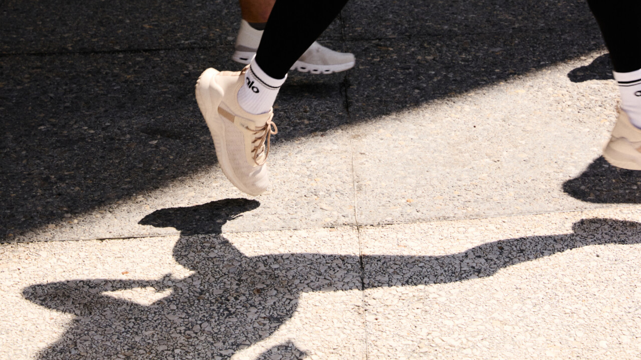Close-up of tennis players’ feet in motion on court