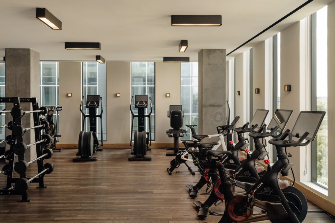 Spacious gym with cardio machines and weights