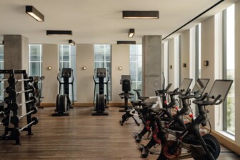 Spacious gym with cardio machines and weights