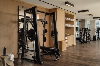 Modern gym with strength equipment and free weights